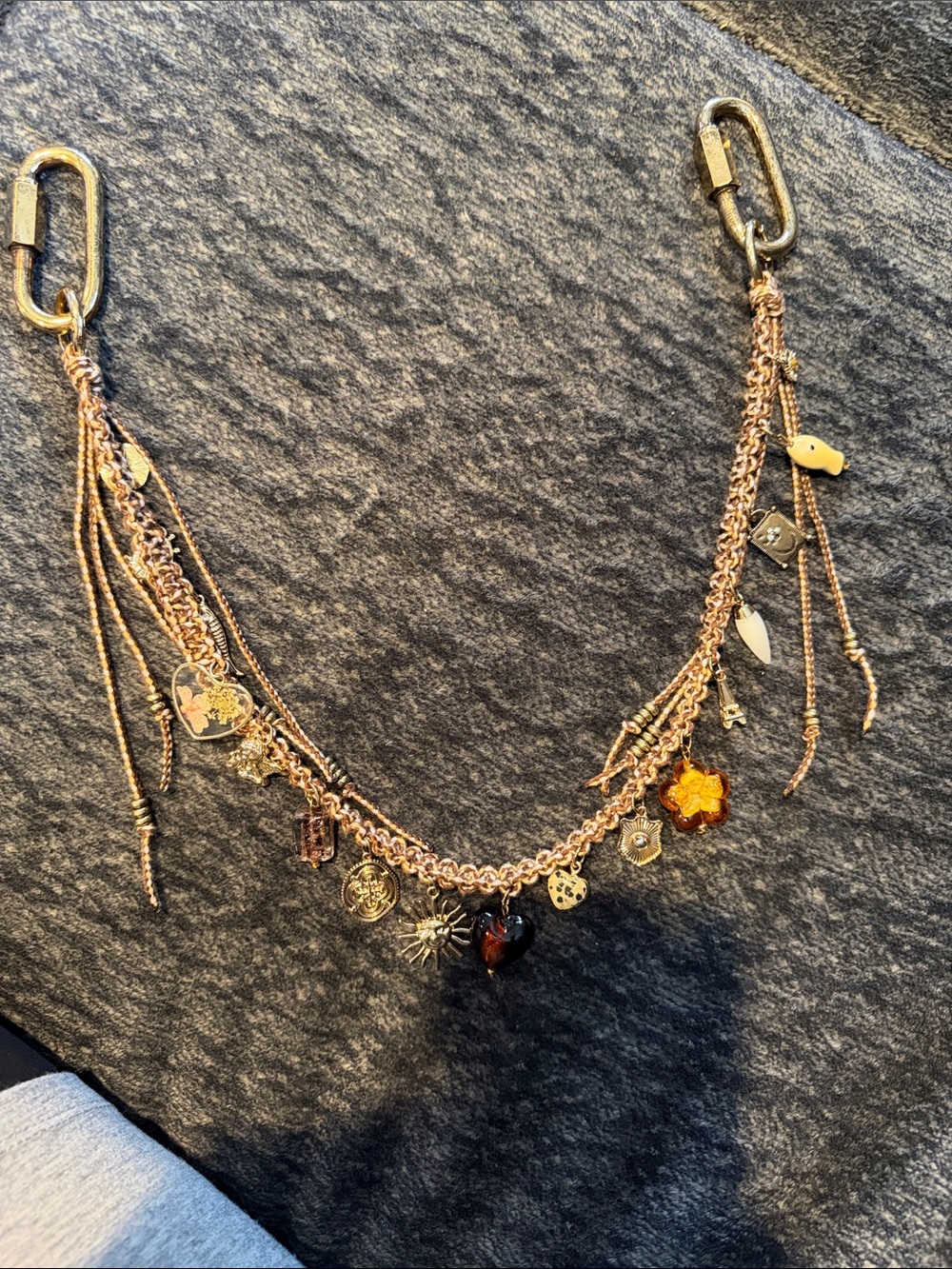 NWOT FREE PEOPLE MOVEMENT GOLD BAG, CHARM.